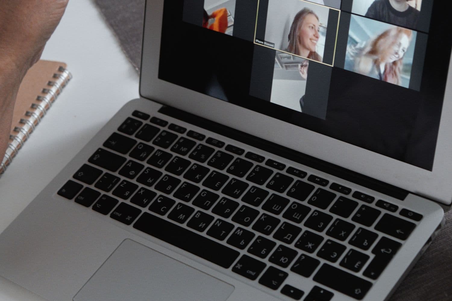 A laptop open on a group video call
